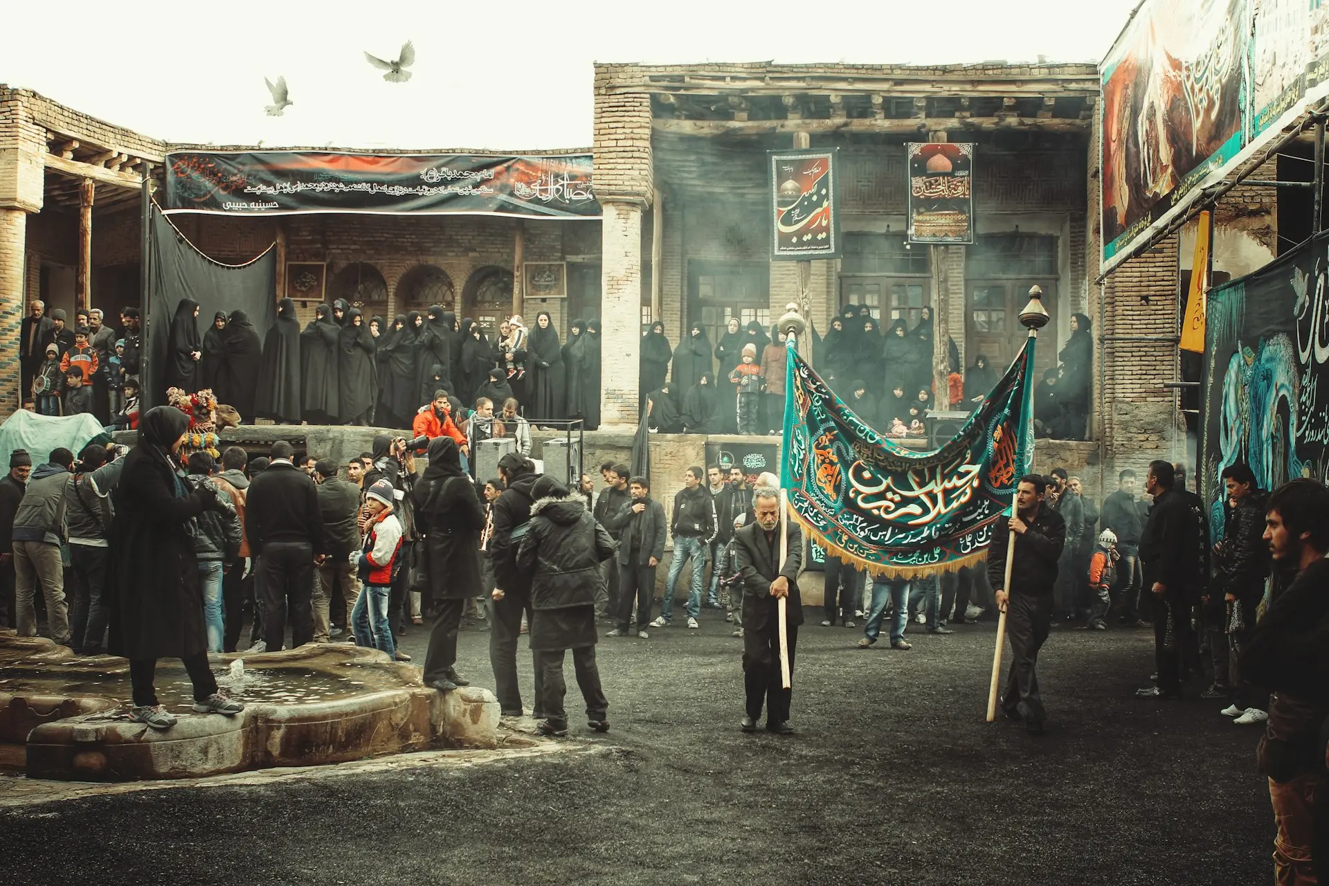A crowd of people standing around a building
